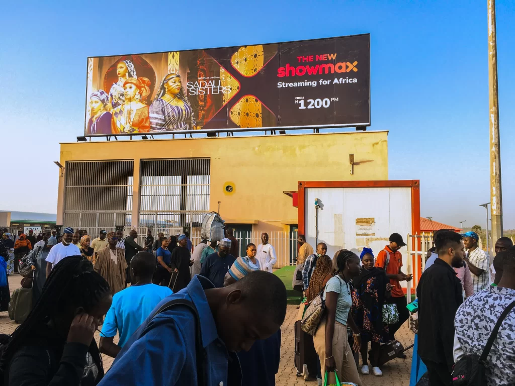 A billboard advertising Showmax 2.0 on a rooftop at the Rigasa Train Station