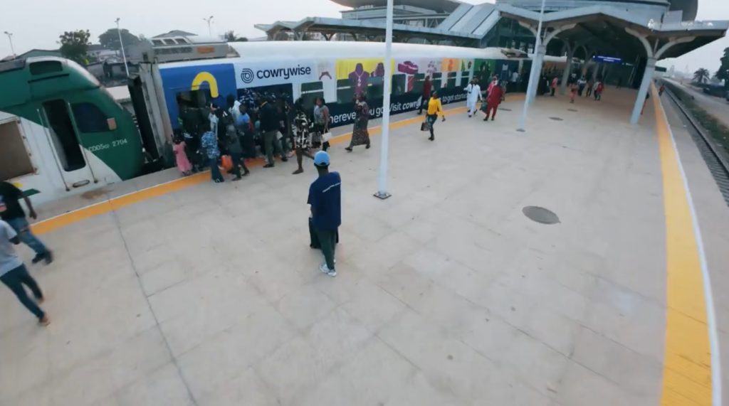 Passengers boarding the Cowrywise branded train