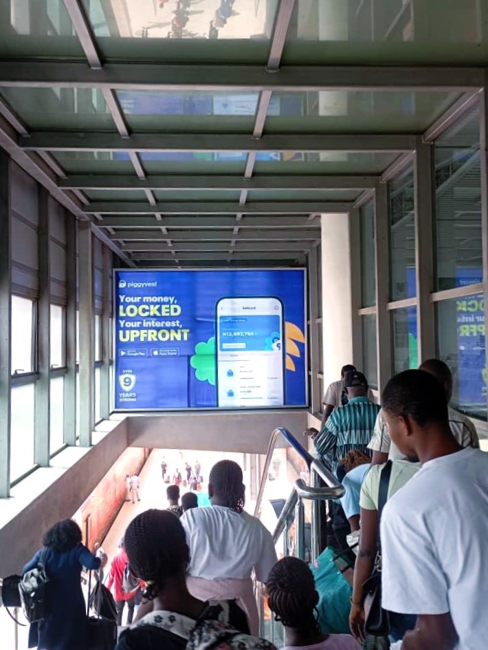 Piggyvest on the Departure stairway of the Mobolaji Johnson Station in Yaba, Lagos