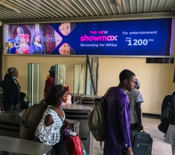 A billboard advertising Showmax 2.0 at the arrival hall of the train station