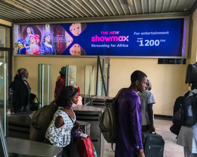 A billboard advertising Showmax 2.0 at the arrival hall of the train station