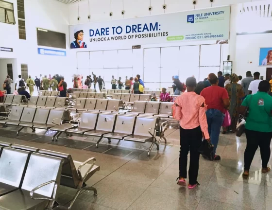 Nile University's billboard at the arrival hall in the Mobolaji Johnson Train Station